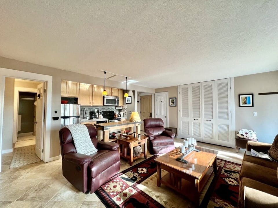 View of living room and kitchen.