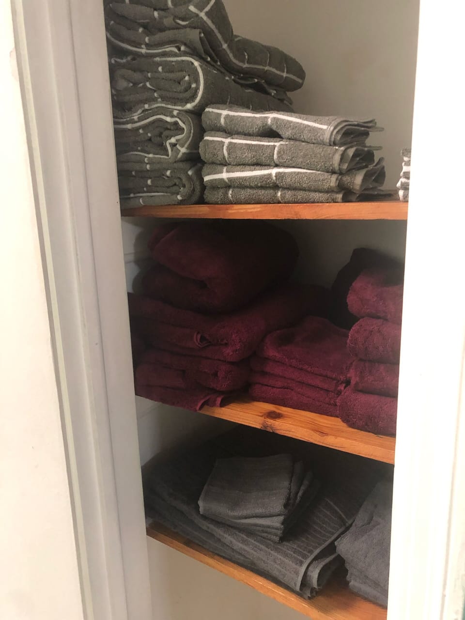 Plenty of towels available in hallway.