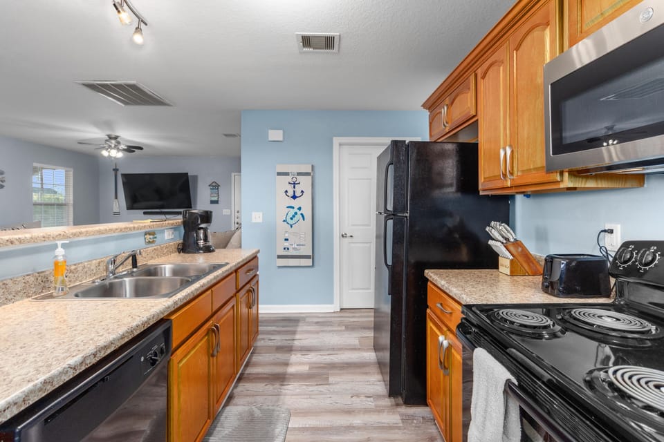 Fully stocked kitchen with utensils, plates, child friendly plates/cups, etc.