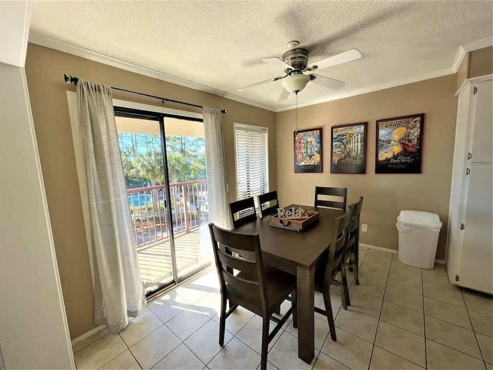 A functional and stylish dining space with a dark wood table that seats six.