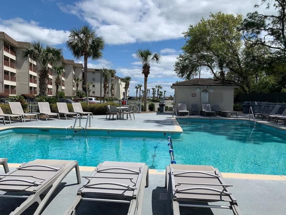 Relax by the large, crystal-clear swimming pool.