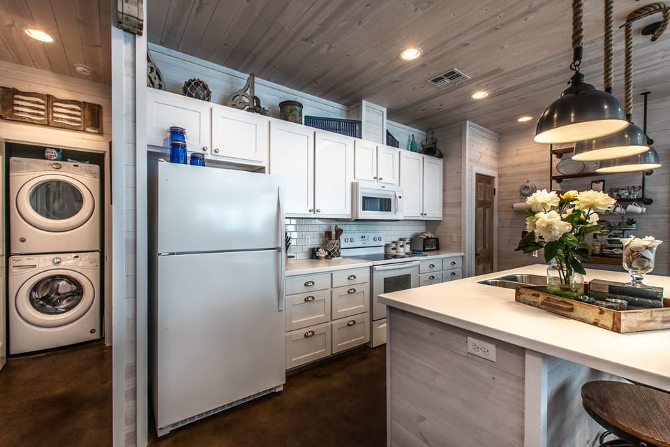 Kitchen with stacked laundry