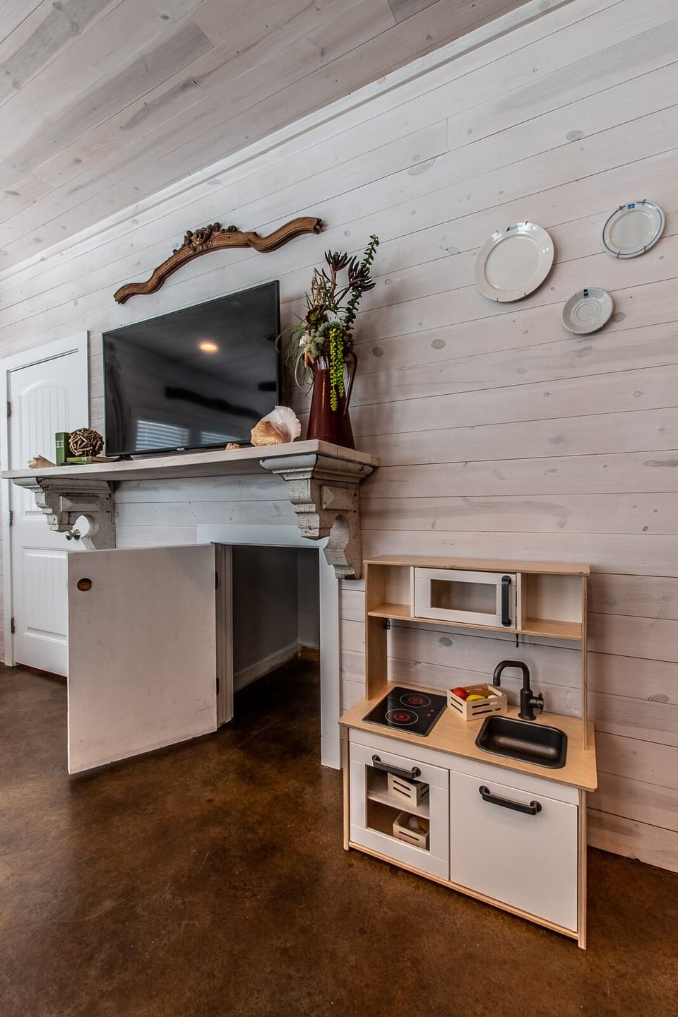Kids play kitchen under TV and extra storage (light inside)