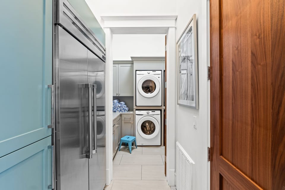 Large laundry room with double washer and dryer