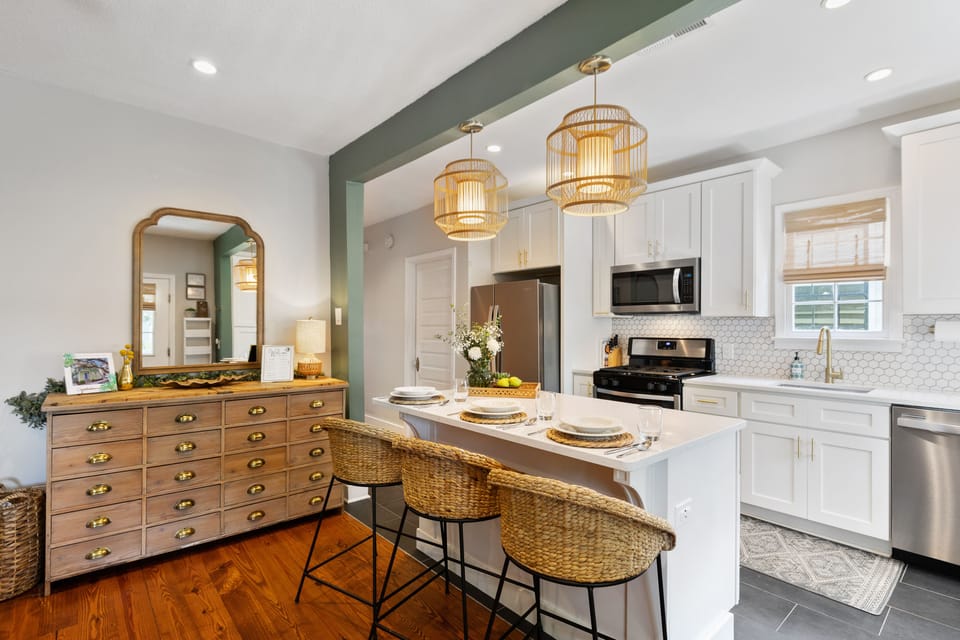 Fully stocked chef's kitchen opens to living room and balcony