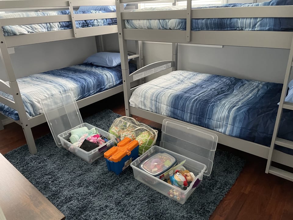 Boxes of toys under the bunk beds