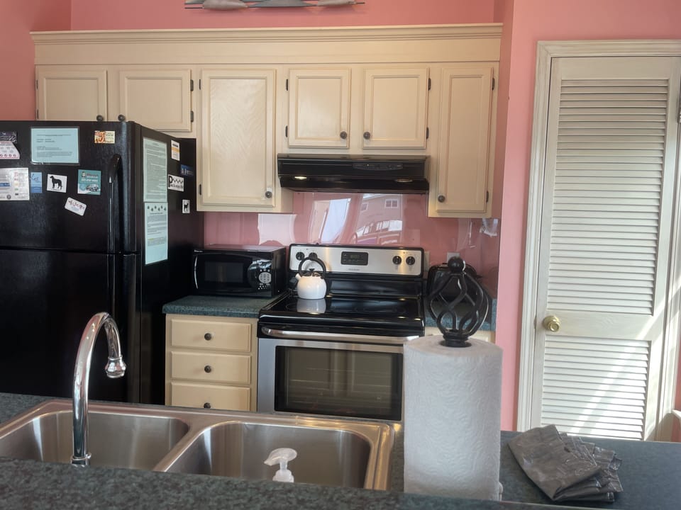 Two coffee makers, toaster, toaster oven, microwave and more