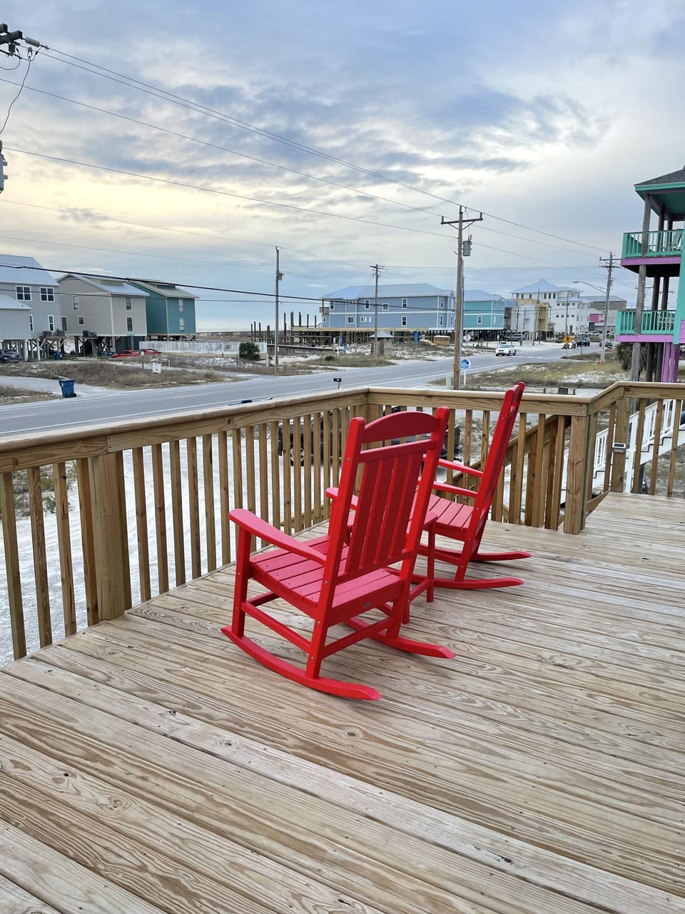 Large porch with beach access visible in the background