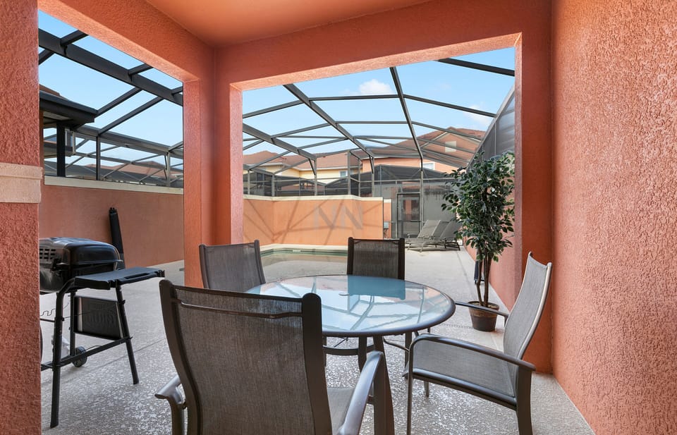 Relax in the outdoor area with a comfortable table and chairs.