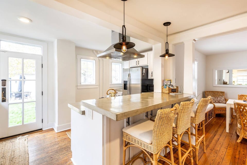The fully-renovated kitchen includes a breakfast bar with seating for 3.