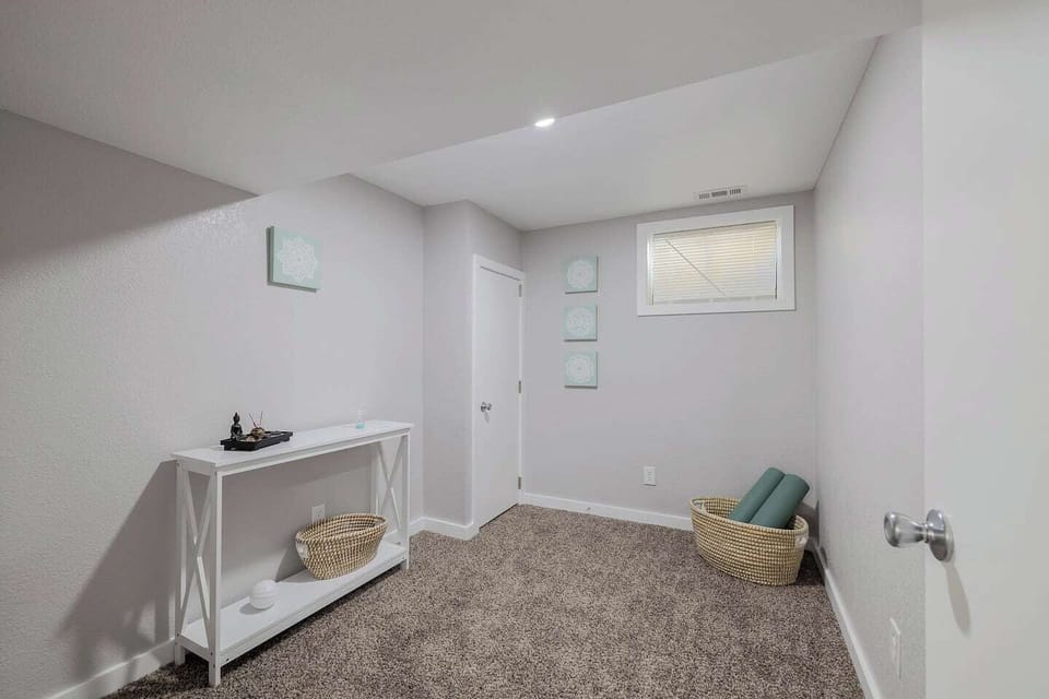 - Peaceful yoga or meditation nook with mat, props, and a calming neutral design
- Soft carpeted flooring and minimal decor create a clean and restful atmosphere
- Ideal for stretching, mindfulness, or unwinding with a gentle home workout