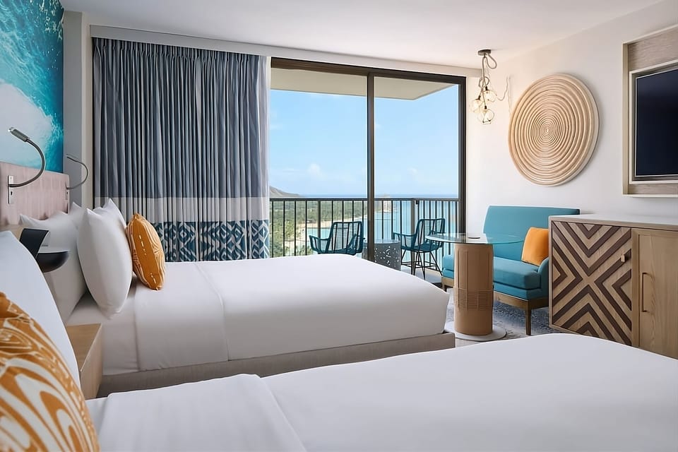 Settle in with extra lounging space and soft coastal tones.