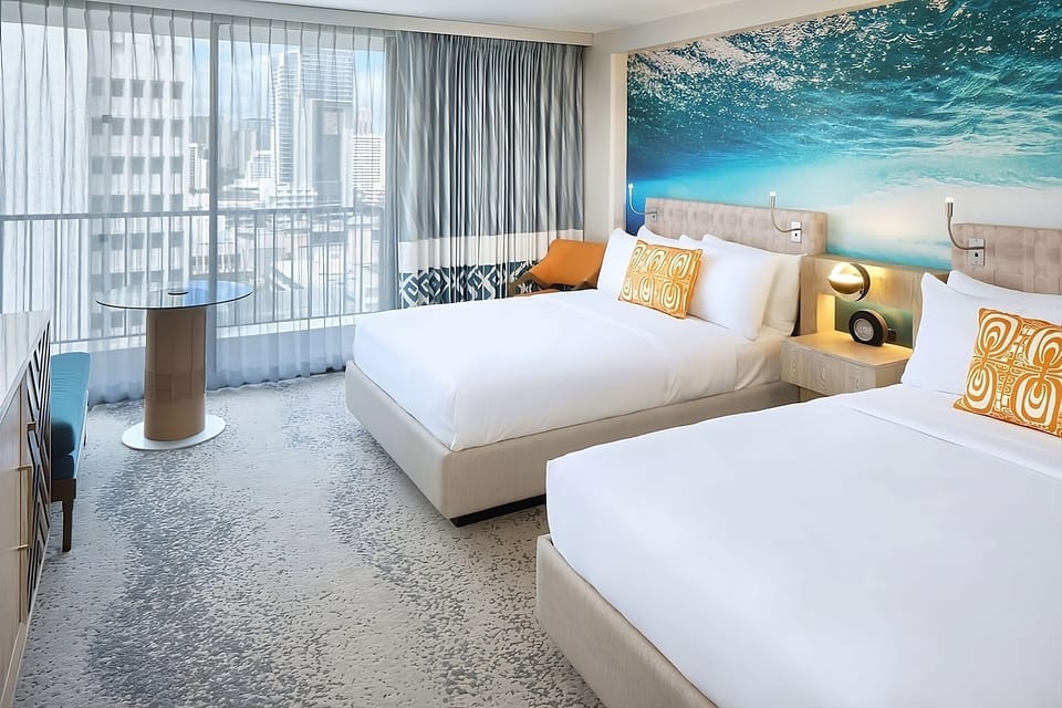 Wake up to bright city views and airy, modern comfort.