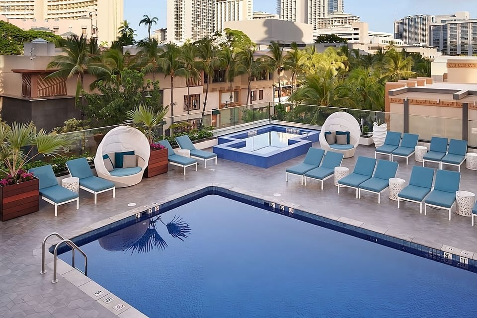 Soak up sunshine with resort loungers and skyline views.