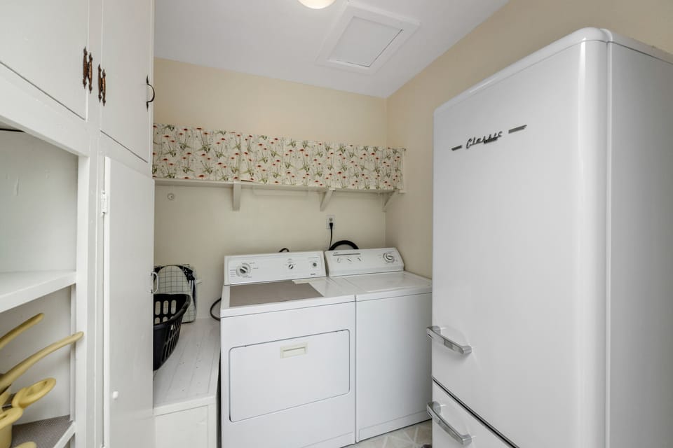 Laundry room, fridge and pantry.