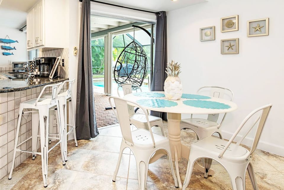 The breakfast bar and table overlooking the pool area