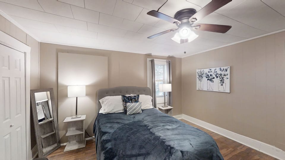 middle bedroom with a queen bed, full closet, smart tv and dvd, full size chest of drawers 