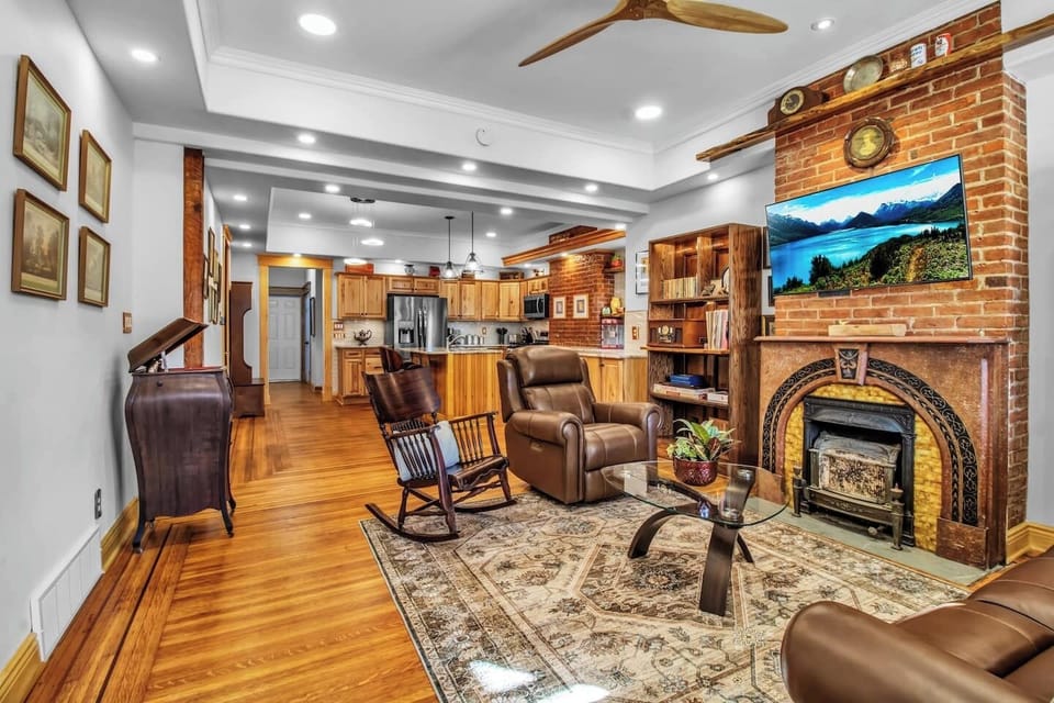 Open-concept living space with a fully stocked kitchen, and plenty of seating to relax! This Airbnb has an extra air mattress in the living room to provide extra sleeping space.