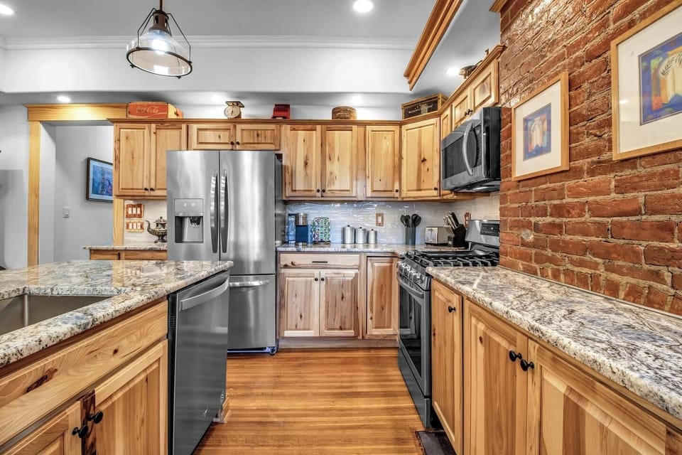 Open-plan living: Our kitchen invites you to cook, dine, and relax in one harmonious space.