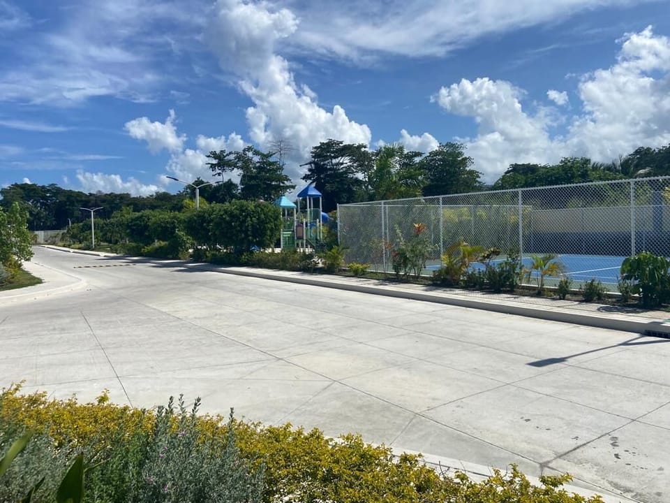 Tennis court and playground area
