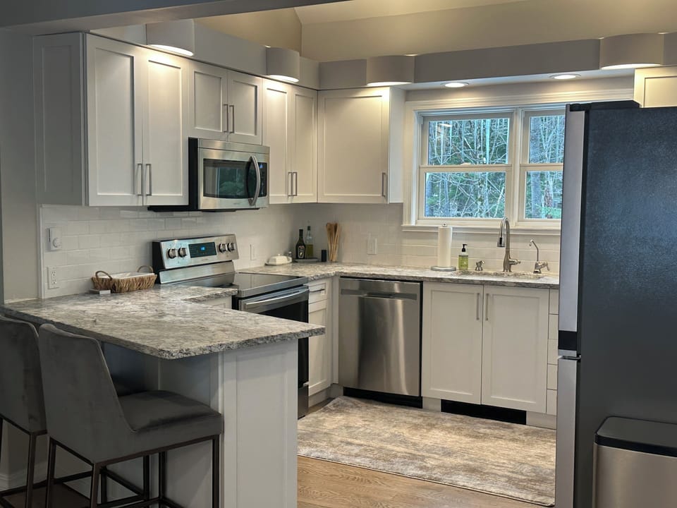 Bright spacious kitchen with eat in counter