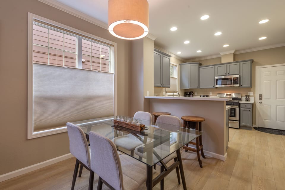 Dining &Kitchen. Dining table for 6 w/ bench from entry, 2 at counter, 8 total.
