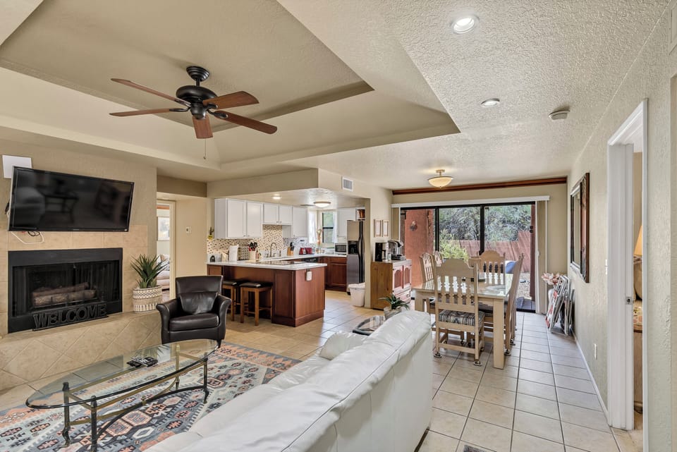 Living room open to kitchen/dining room and out to patio