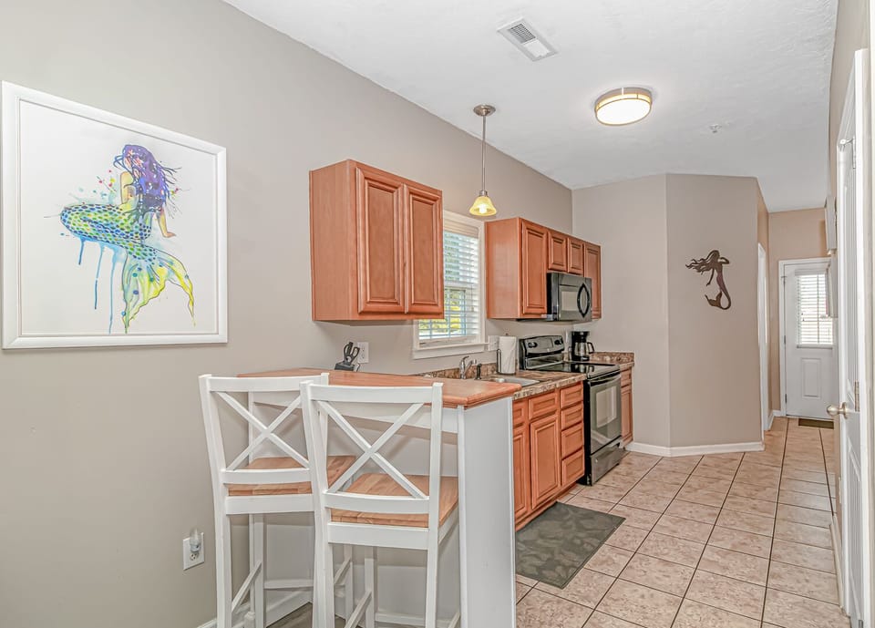 Custom cabinetry and designer finishes in the spacious kitchen.