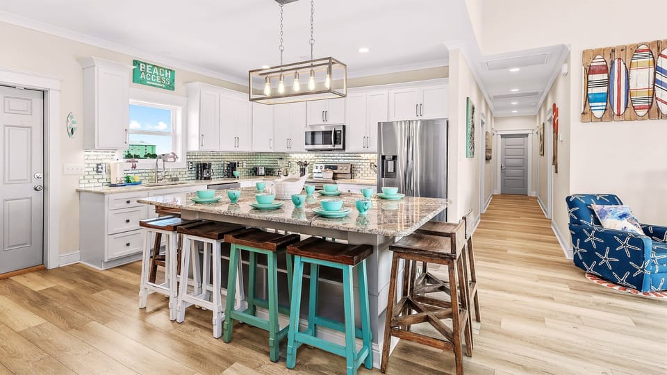 Enjoy a meal at a beautiful kitchen island dining table that seats 12.