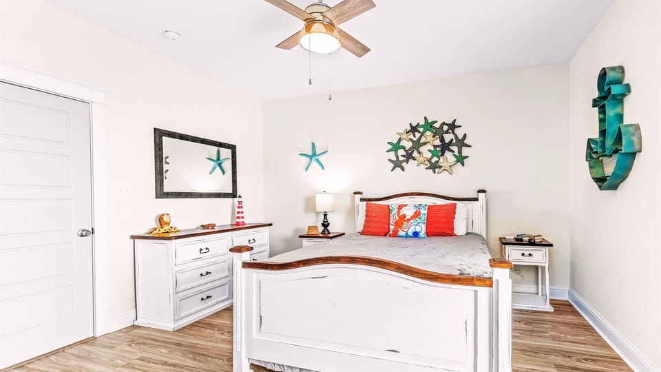 Our Sea Star Bedroom 6 has a queen-sized bed, closet, and dresser.