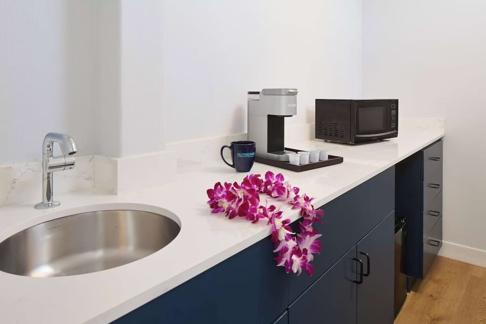Prepare quick bites with a handy kitchenette and bright counters.