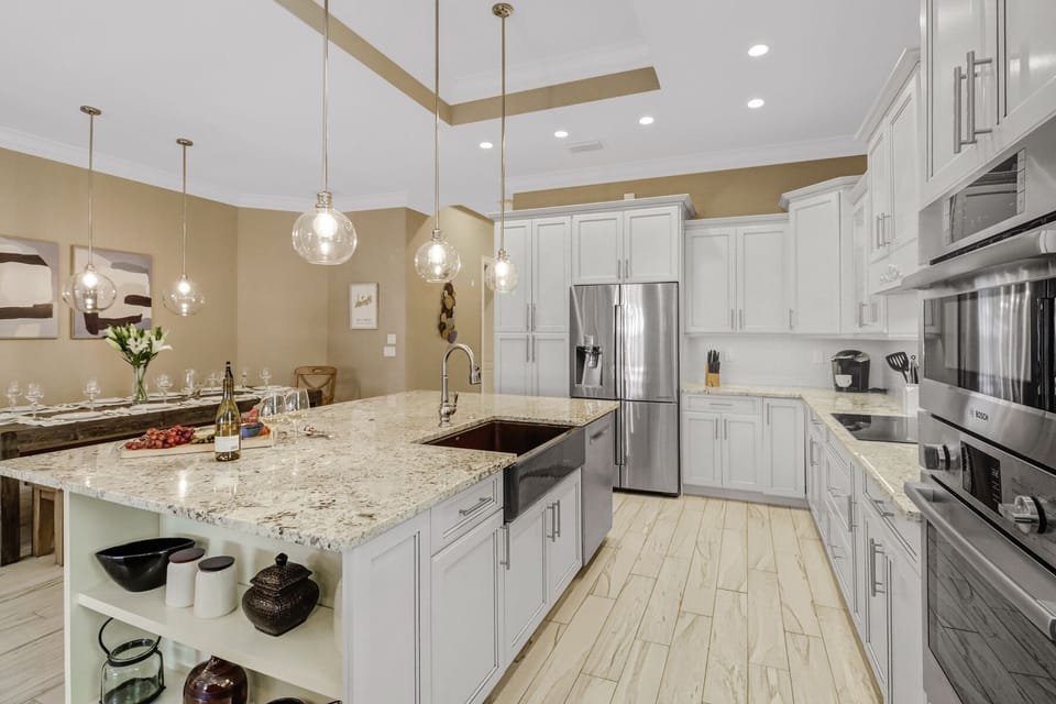 High-end Bosch appliances and oversized farmers sink.
