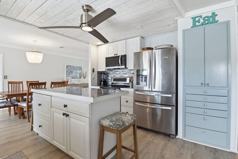 FULLY EQUIPPED OPEN KITCHEN - CENTRAL TO ALL ROOMS AND LIVING AREAS. 