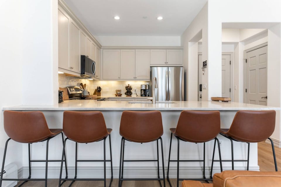 Comfortably Plan the Day's Adventures at this Kitchen Bar with Seating for up to 5!