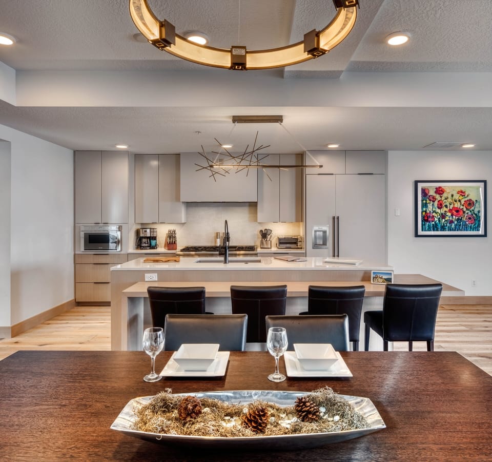 Solid wood dining table seats 8-10. Open room floorplan keeps everything flowing
