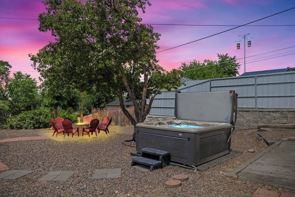 Enjoy the sunset glow while soaking in your private hot tub escape.