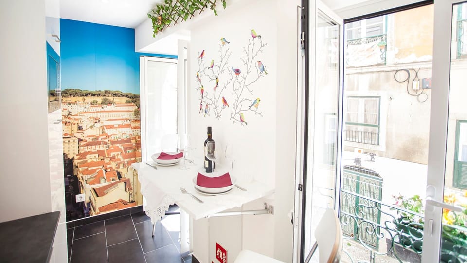 Table for 2 with a lovely view over the avenues of Lisbon #airbnb #airbnblisbon #portugal #pt #lisbon #kitchen #tablefortwo #lovelyview