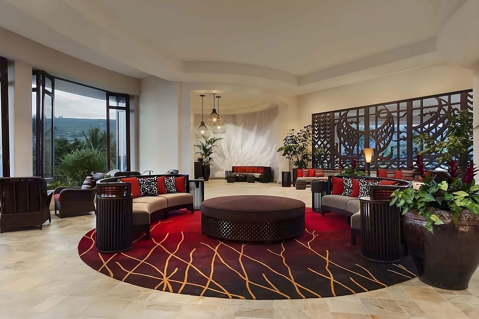 Gather on plush seating under soft light and island breezes.