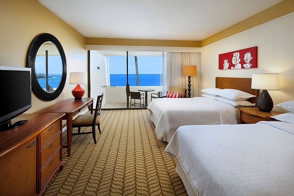 Stretch out on double beds as the Pacific sparkles.