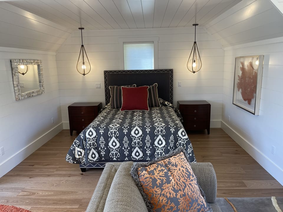 Queen bed in bonus room with private bath and kitchenette