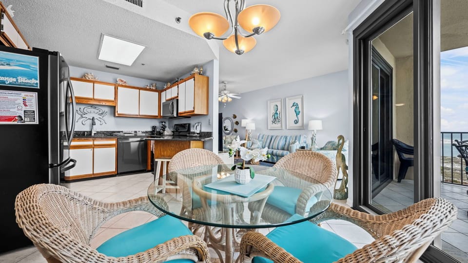 Gaze out from your cozy nook as sunlight dances across the glass dining table, igniting family laughter and joy