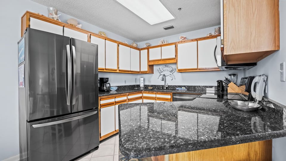 Whip up family favorites in the inviting kitchen, where ample space and charm inspire culinary adventures together