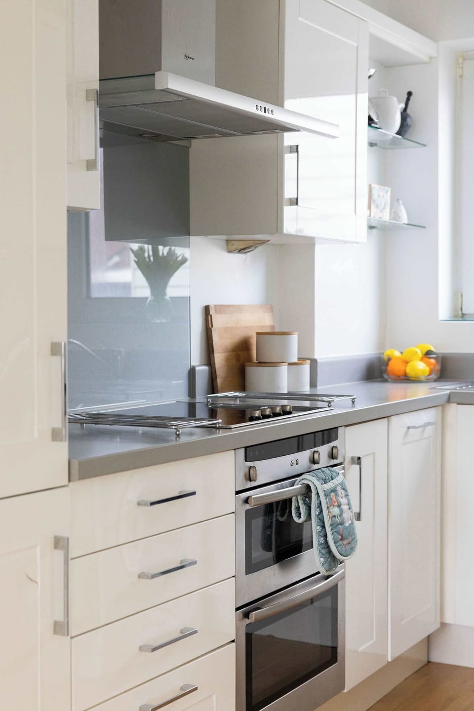 Well-equipped kitchen area with oven, hob, and ample storage, ideal for preparing delicious meals during your seaside getaway.
