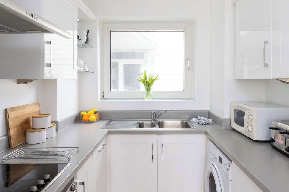 Light-filled kitchen with window views, modern appliances, and everything you need for relaxed holiday dining.