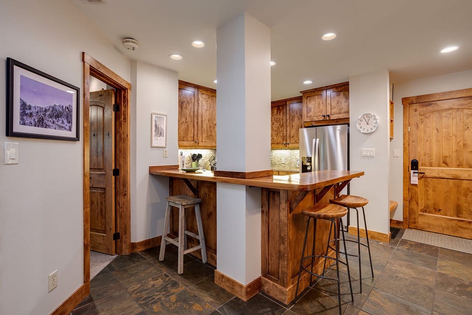 Gather around your rustic kitchen island for morning coffee or evening conversations in this beautifully appointed space.