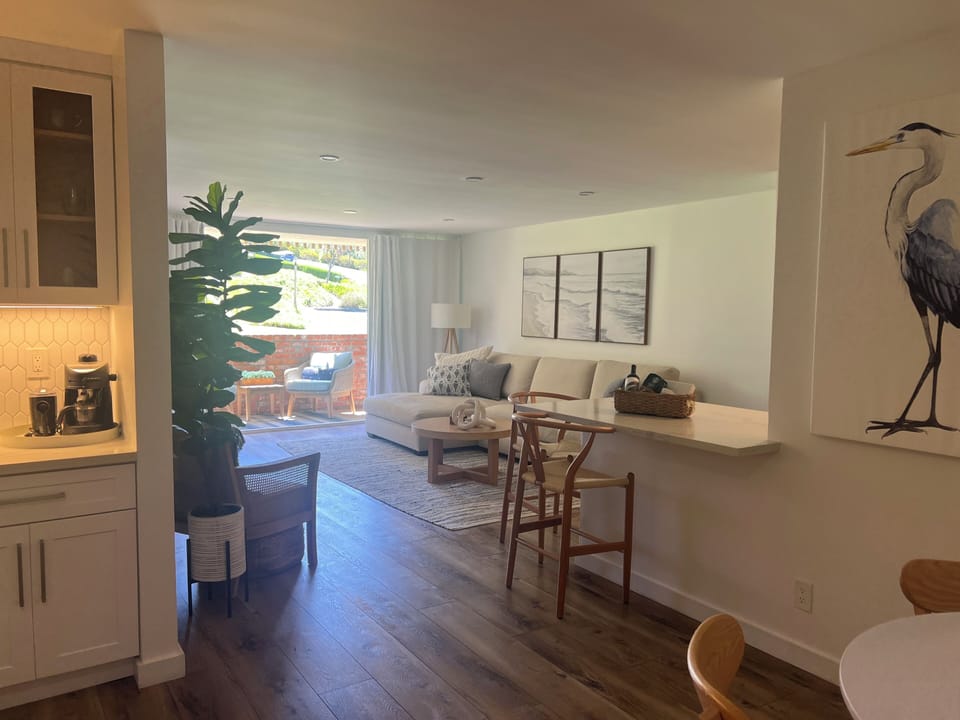 view of living & dining from front door entrance