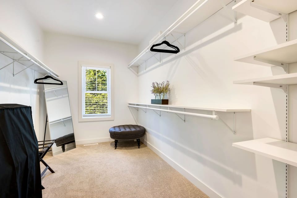 Step into the walk-in closet/dressing room – the perfect space to prepare for any affair or a leisurely evening out, adding a touch of convenience and elegance to your stay.