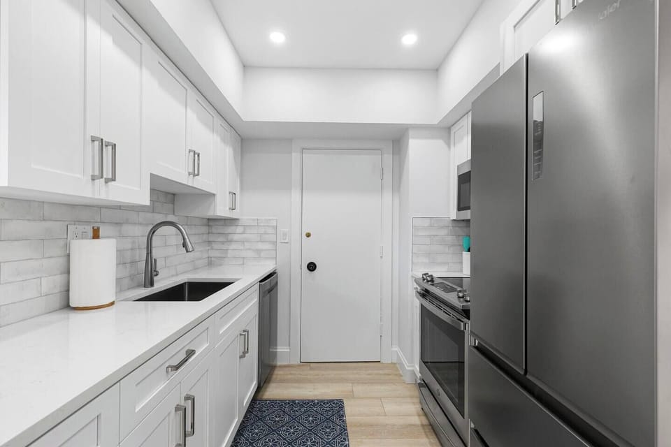 Galley Kitchen with Stainless Steel Appliances