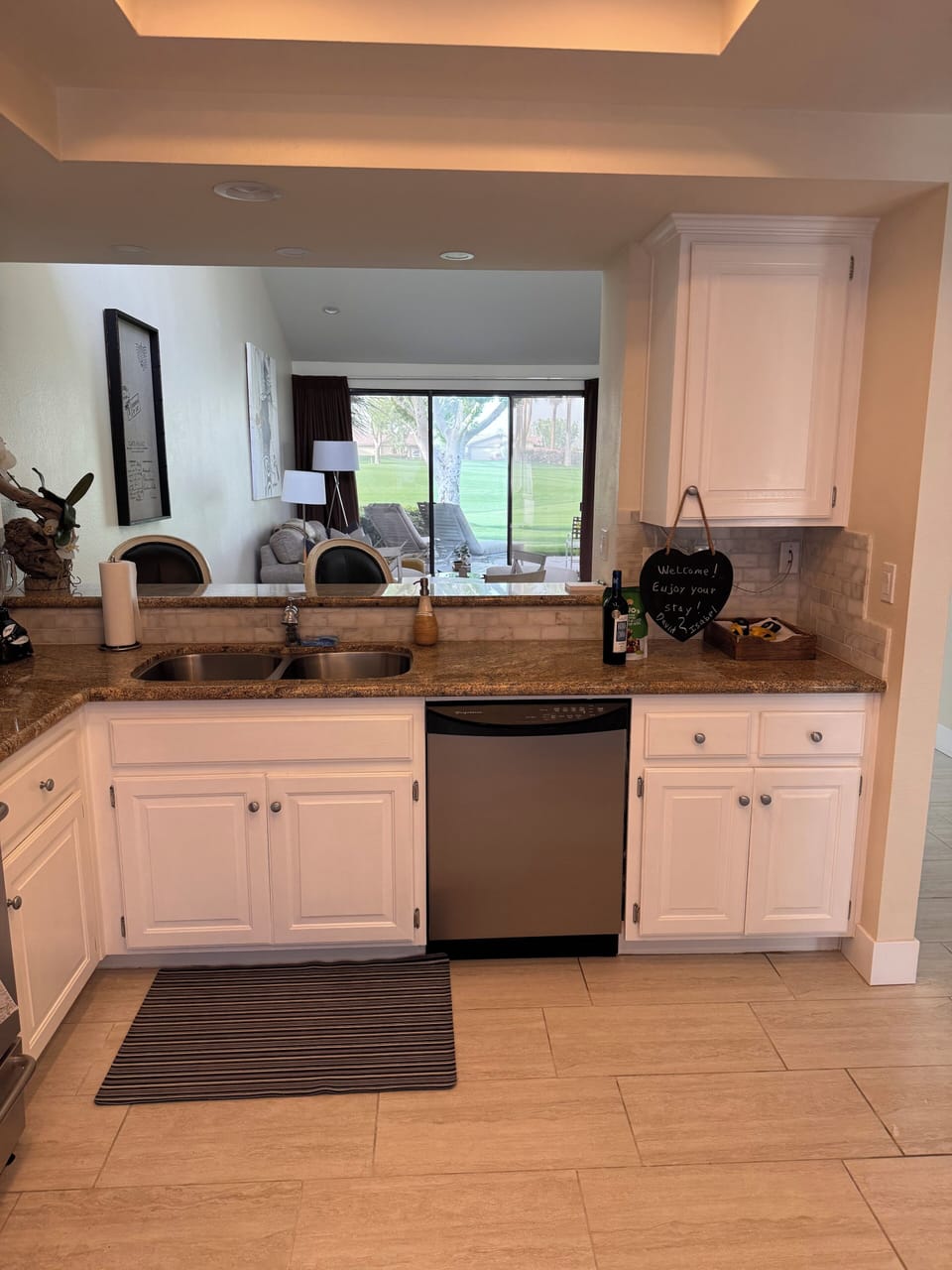 Kitchen view to Living room and back yard