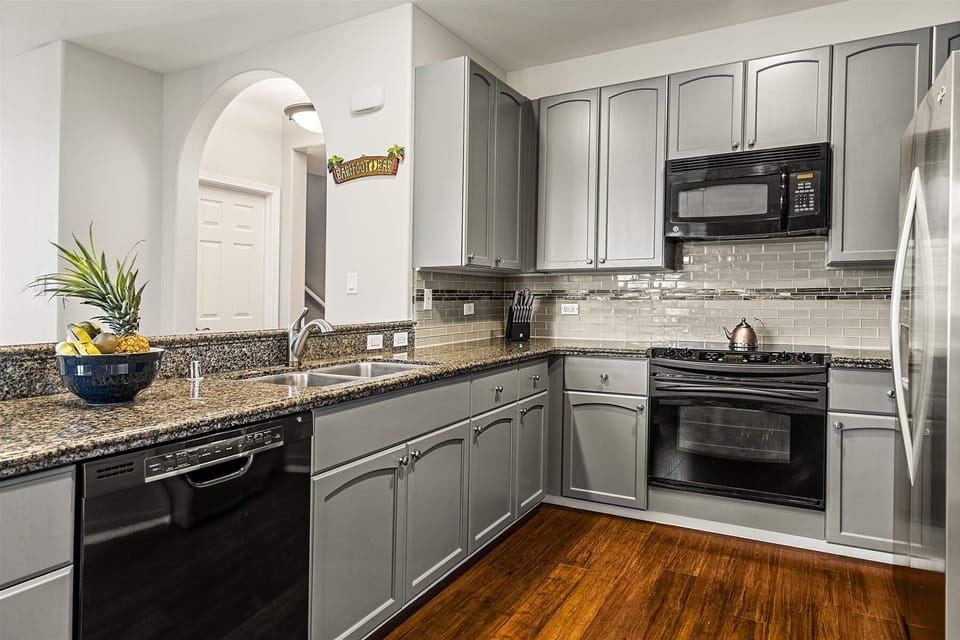 Full kitchen with granite counters and modern appliances